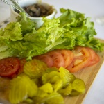 Platter with lettuce, tomato, pickle