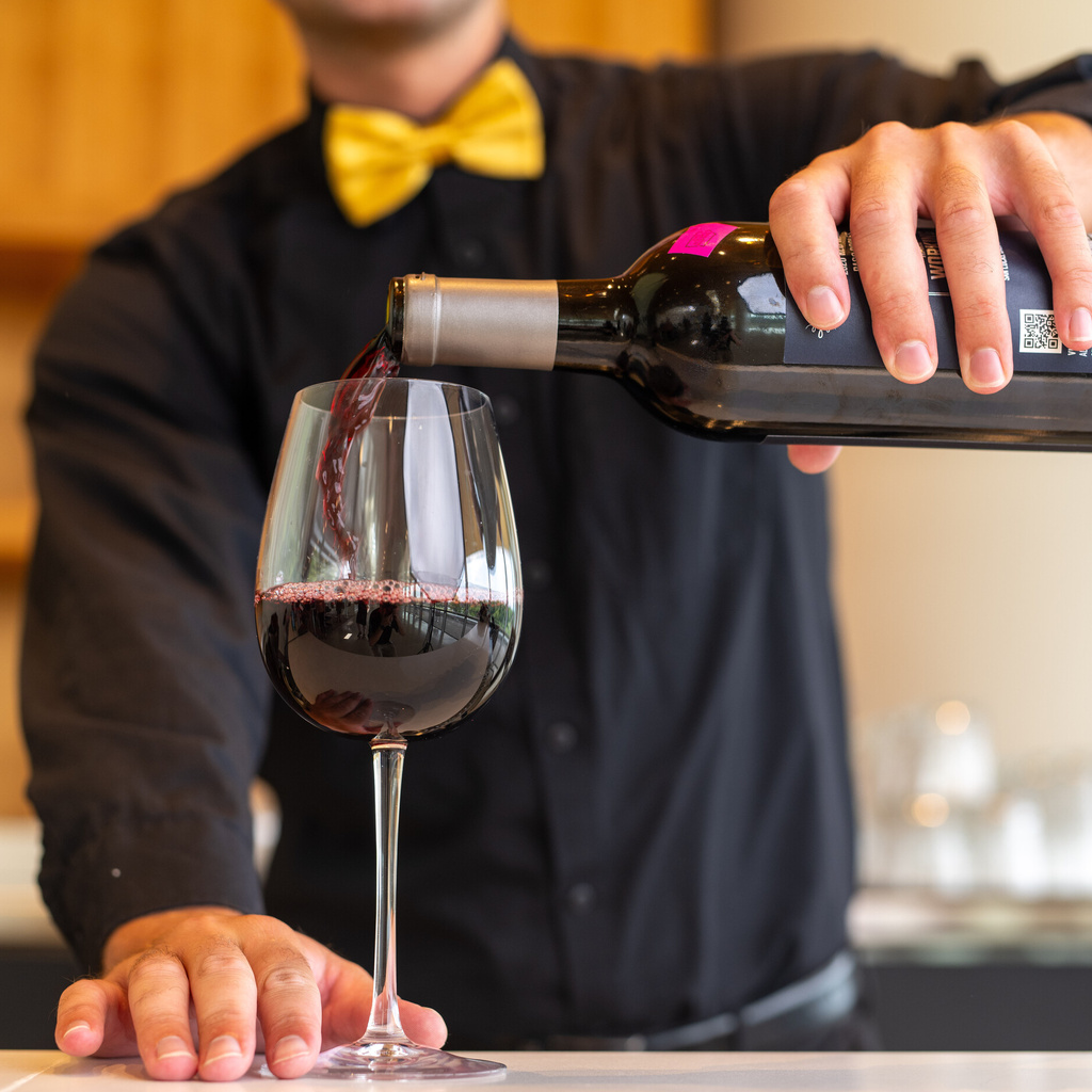 Red wine pouring in a glass
