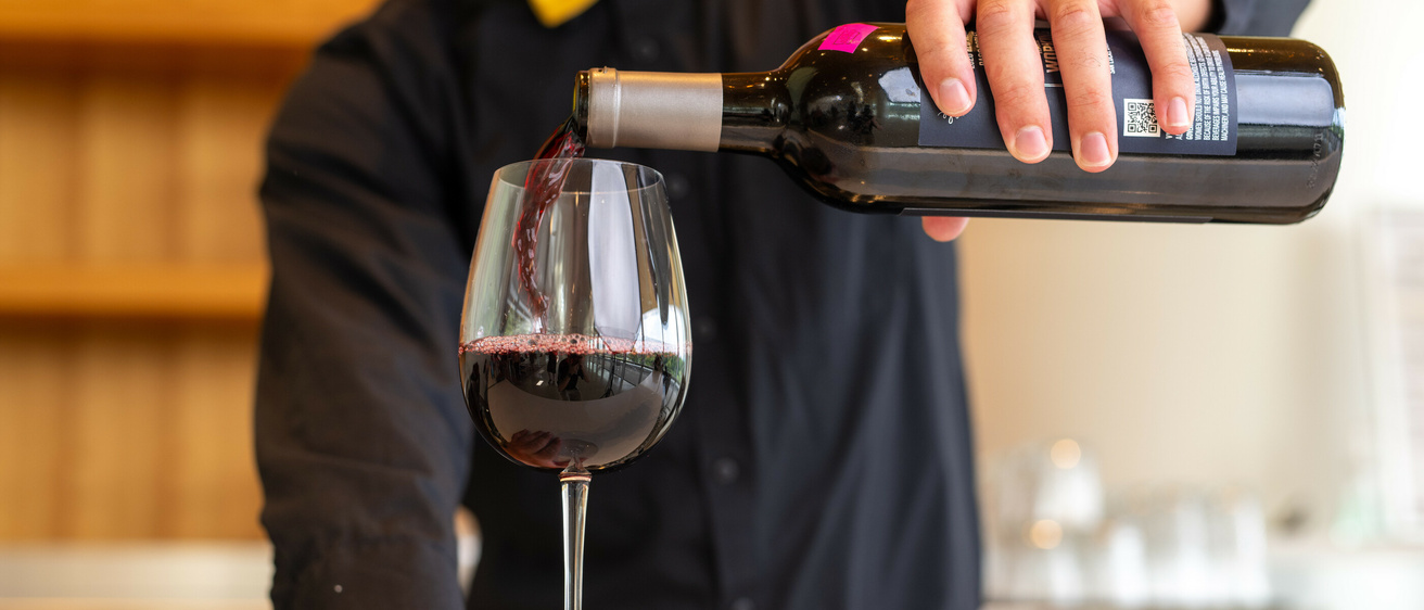 Red wine pouring in a glass