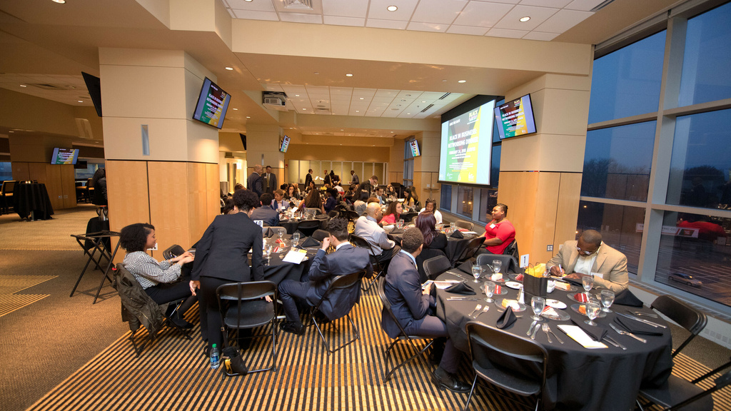 People in a room at a table