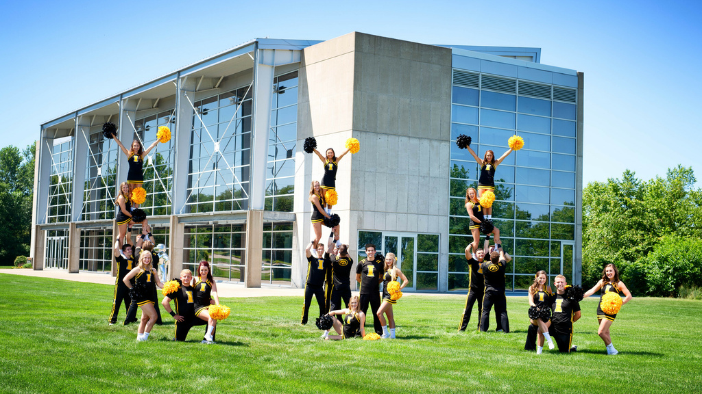 Cheerleaders outside of a building
