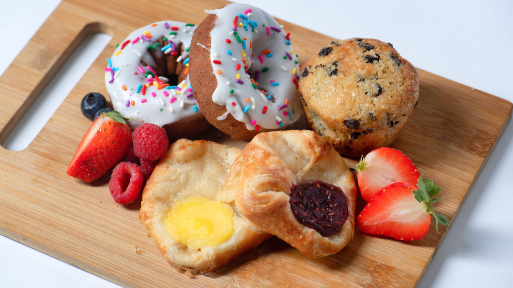 breakfast pastries on a wooden platter